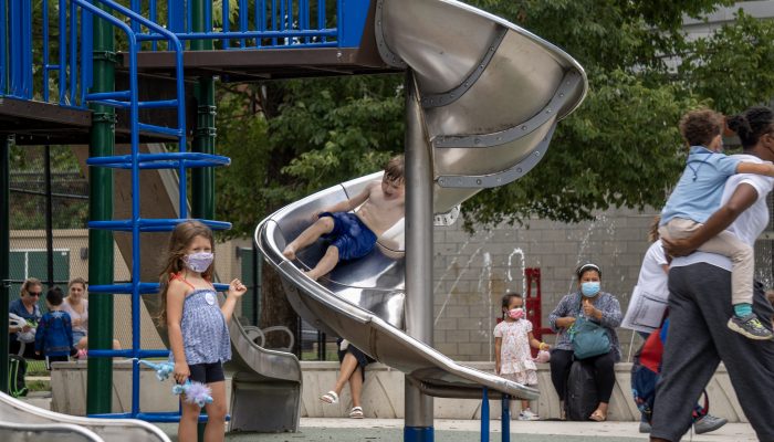 Families at the renovated Columbus Square playground and sprayground.