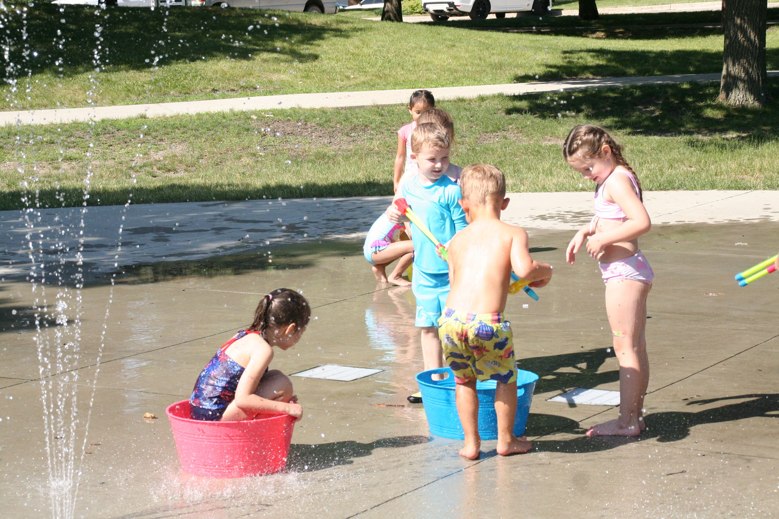 Children enjoying water play at an Ankeny splash pad.