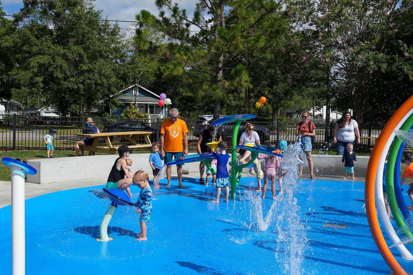 Families play at the Doty Park Splash Pad
