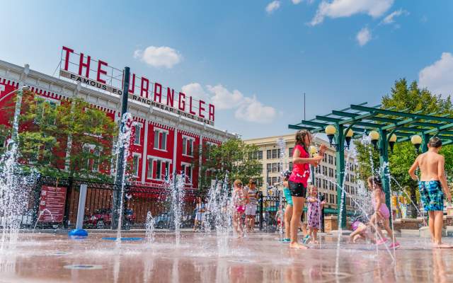 Children playing in the Cheyenne Depot Plaza splash pad.