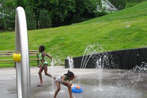 Children playing at Drew Park Sprayground in Arlington.