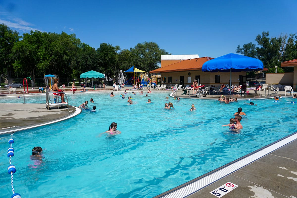 Wide view of Elks Aquatic Center pool and building.