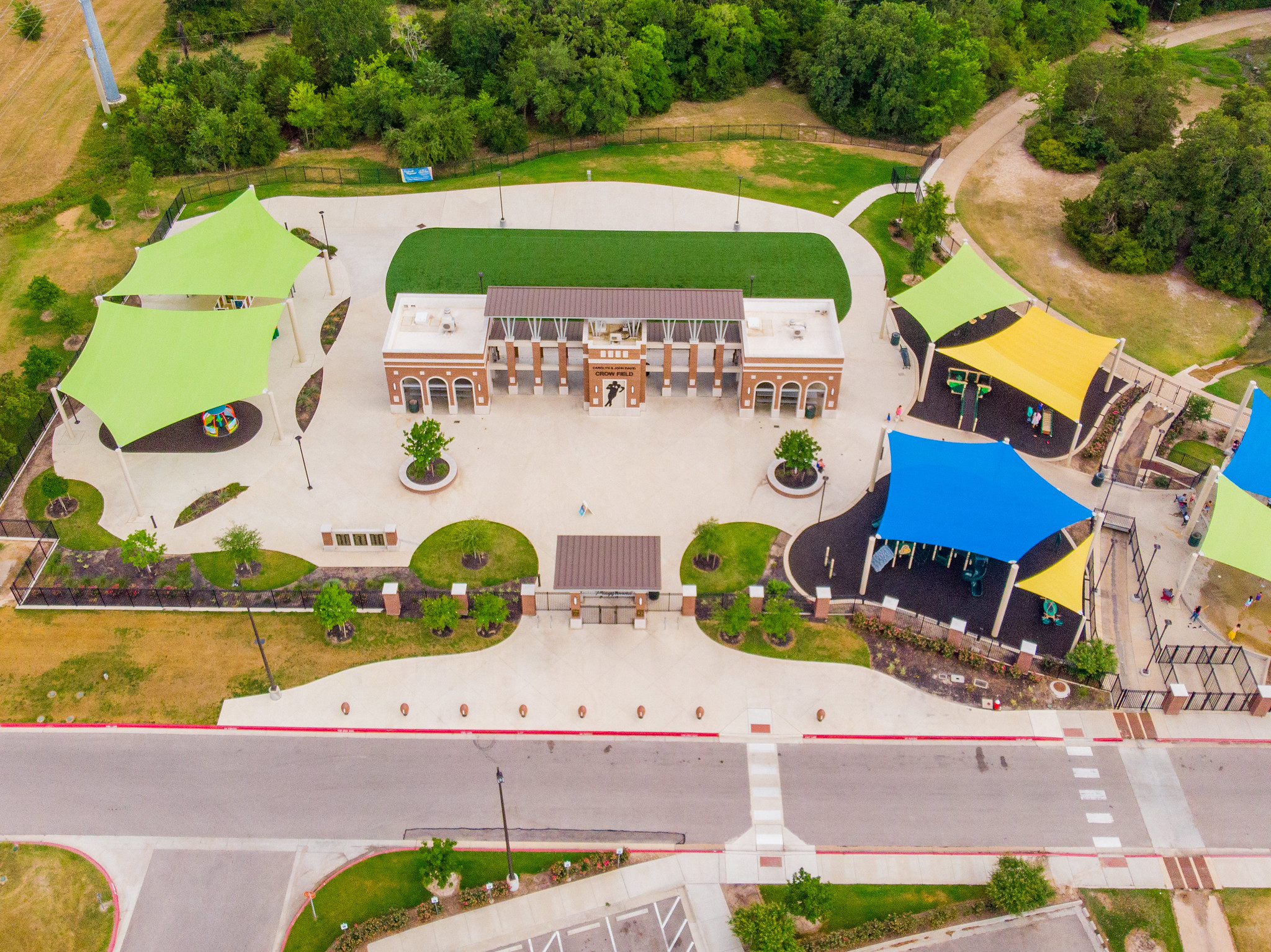 Wide view of inclusive play areas at Fun for All Playground.