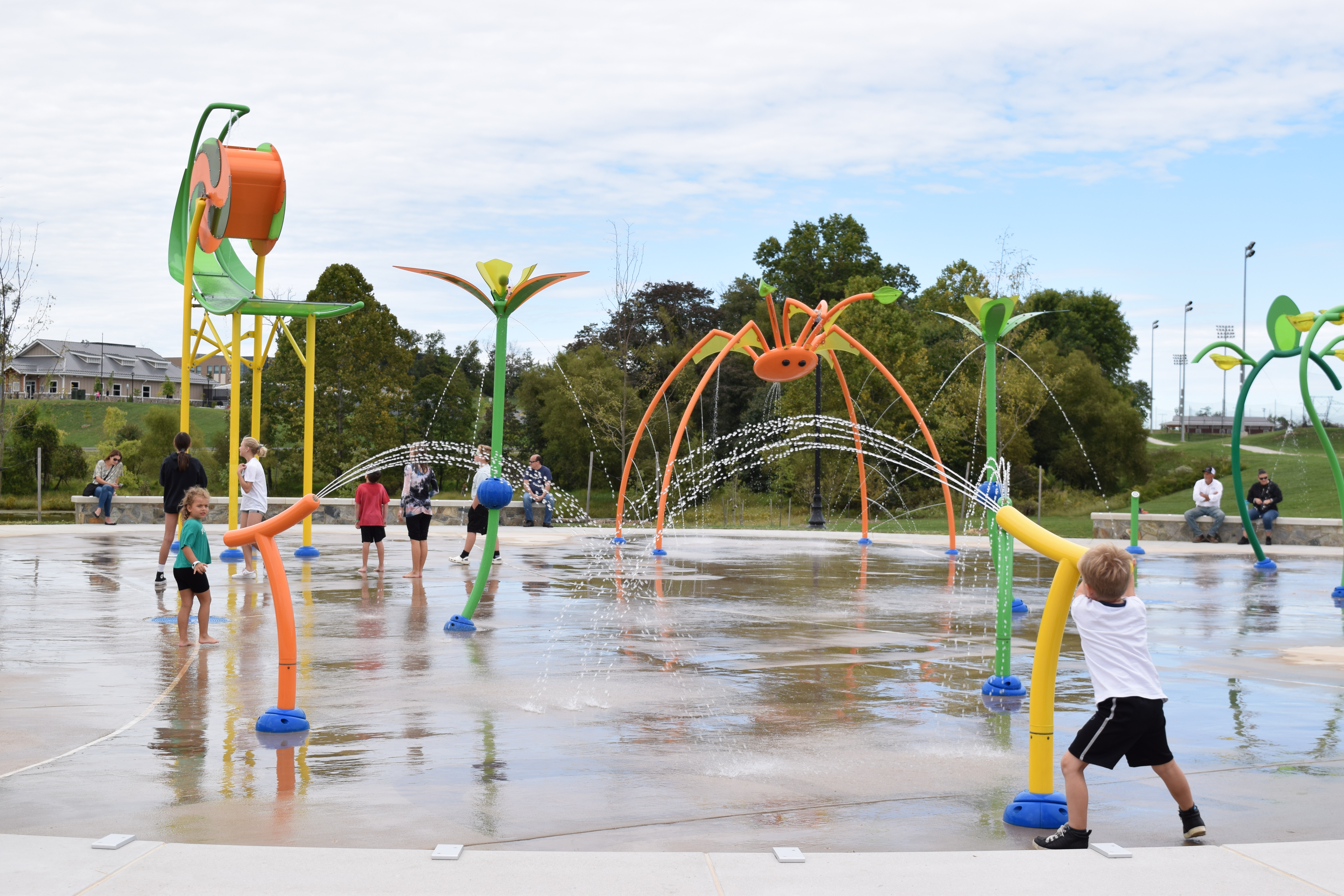 Children playing at the splash pad at Hal and Berni Hanson Regional Park in Aldie.
