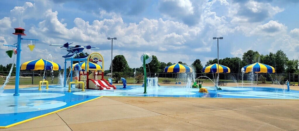 Families using the Harrison Taylor Splash Pad in Tuscaloosa.