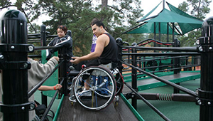 Playground for All Children area at Hermann Park with associated interactive water play nearby.