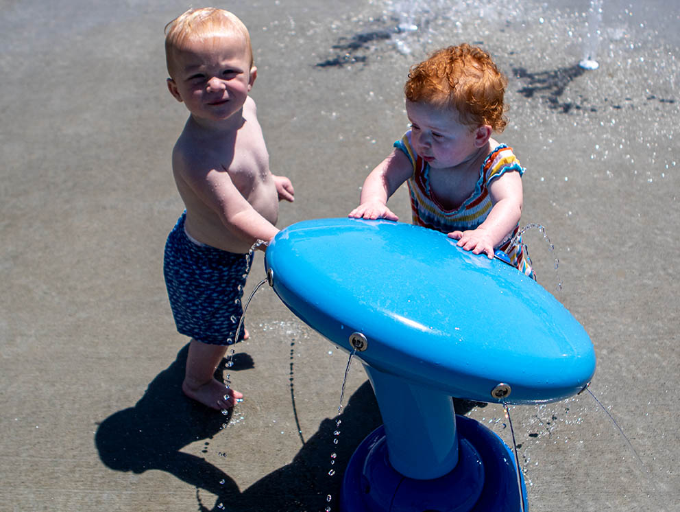 Children at the fountain area at Huether Family Aquatics Center.