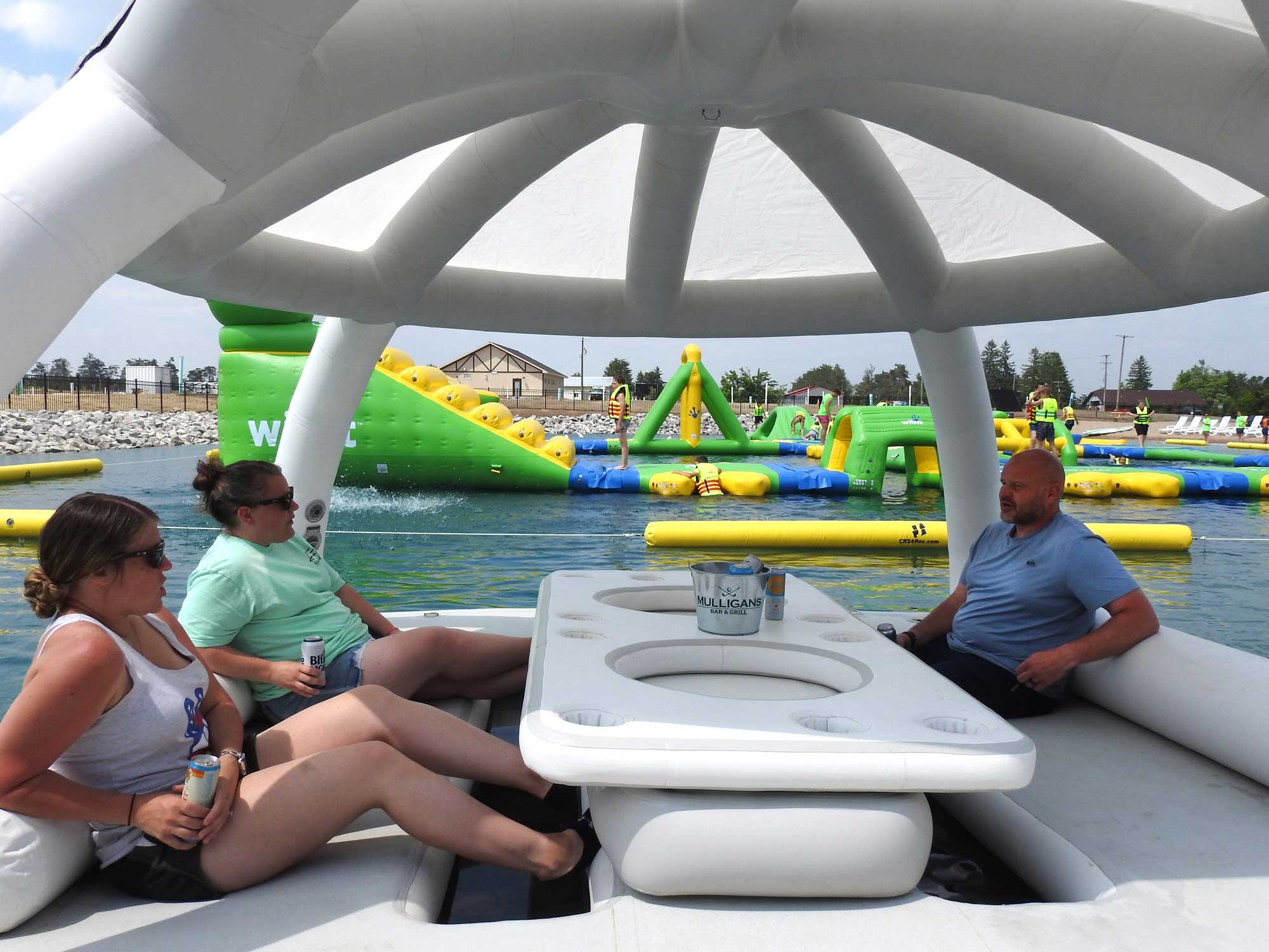 Guests relaxing near a cabana at Inukshuk Shores.