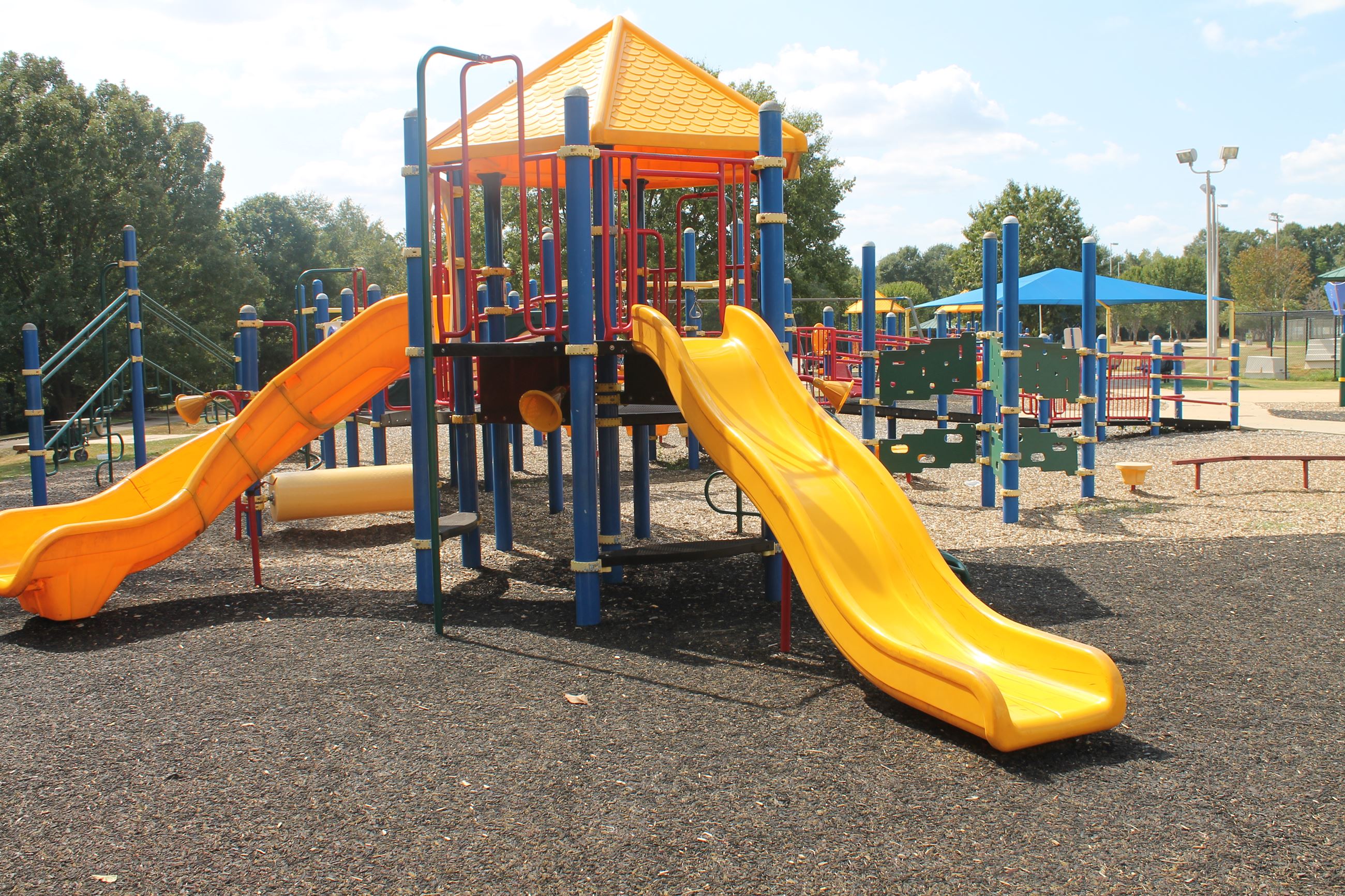 Playground beside Johnny Henderson Family Park splash pad.