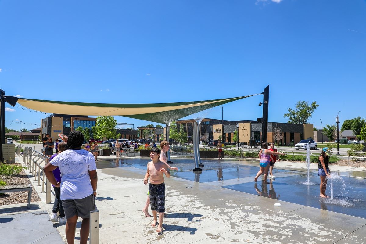 Kids playing at the Johnston Town Center splash pad.