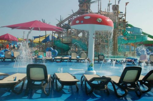 Official Jolly Roger splash pad image with fountains and seating nearby.