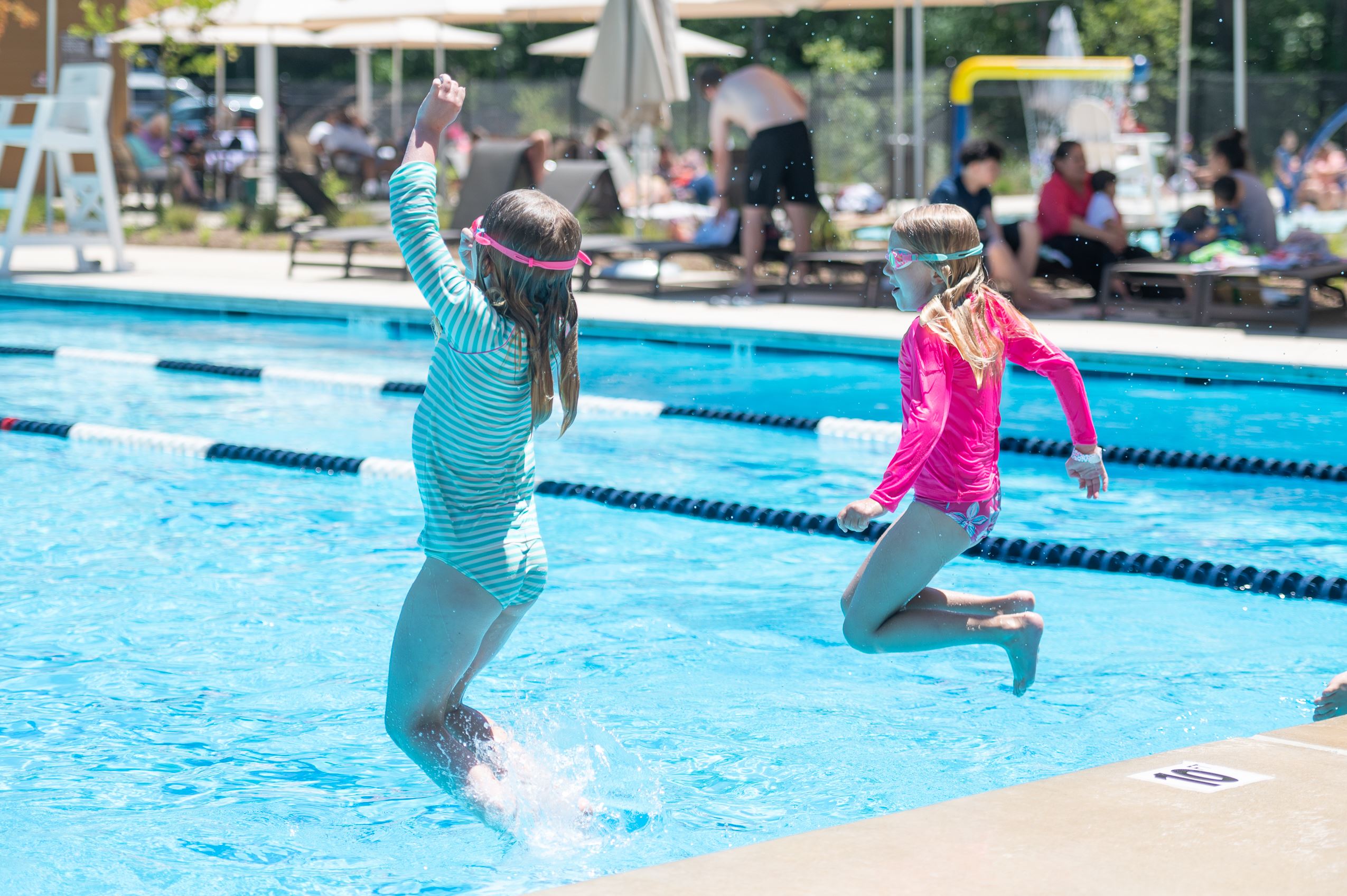 Overview of swimmers at Dunn Municipal Pool in Truxtun Park.