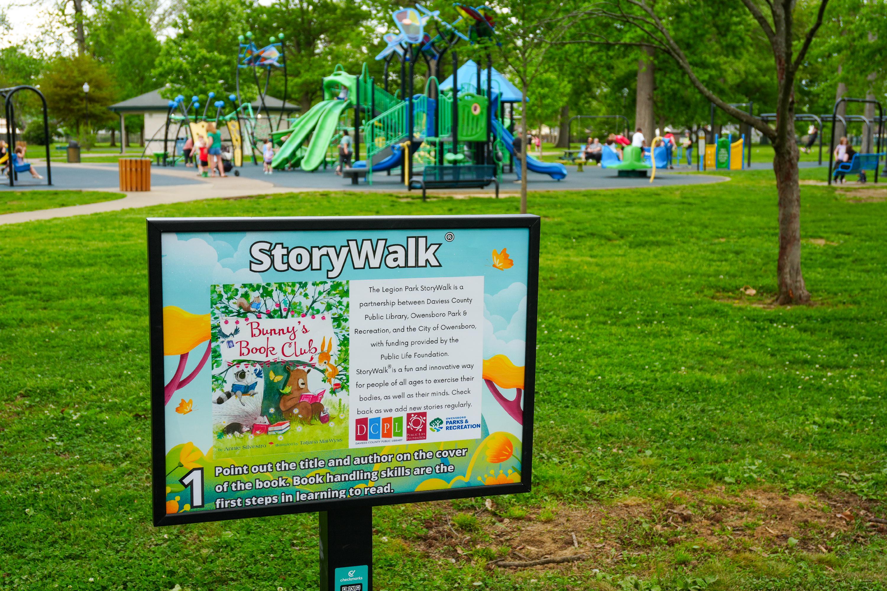 StoryWalk sign and family park landscape at Legion Park in Owensboro.