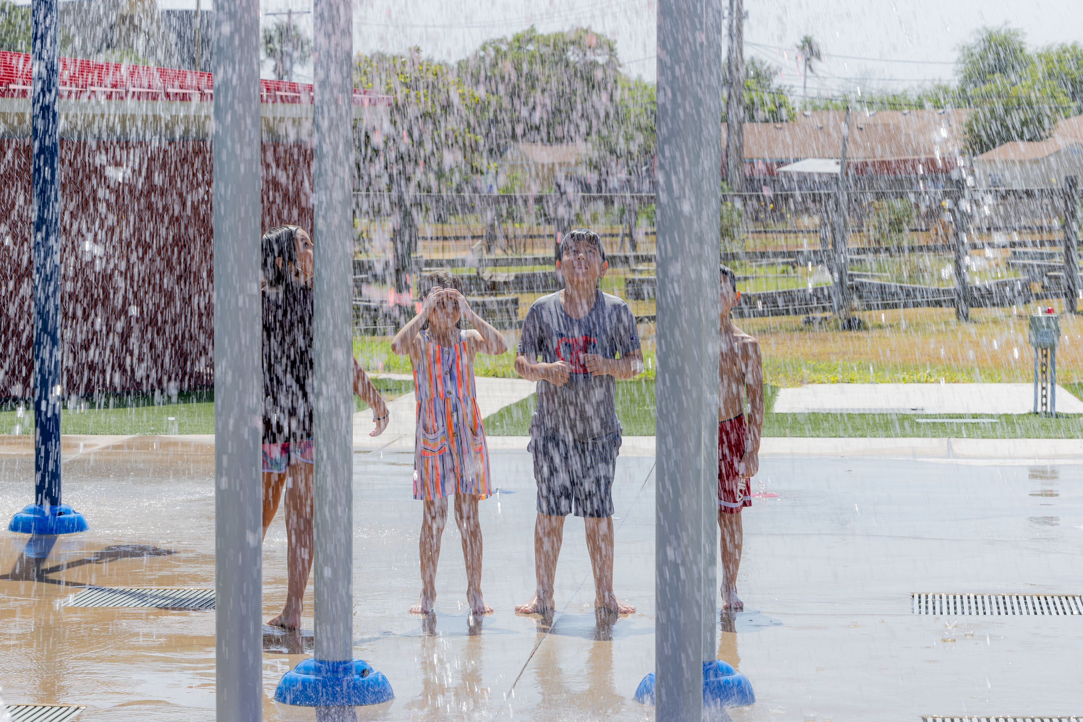 Kids using Lindale Park Splash Pad.