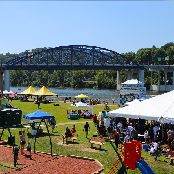 Magic Island Park improvements view showing the splash pad area and surrounding lawn in Charleston.
