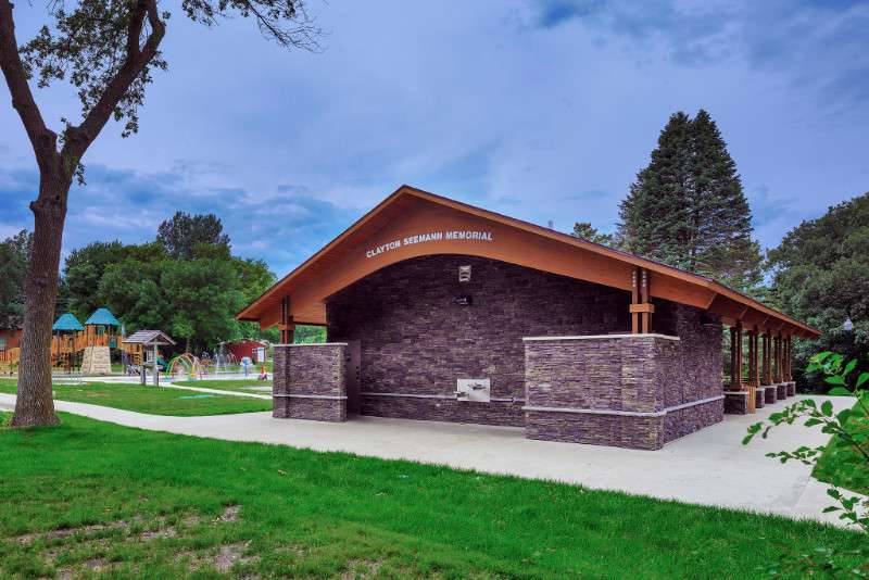 Wide view of Memorial Park in Spirit Lake near the splash pad and shelter area.