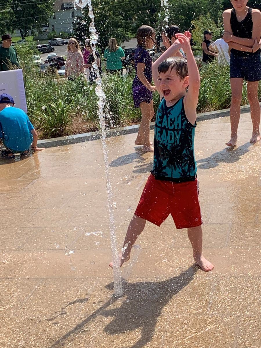 Child in the Memorial Park water feature.