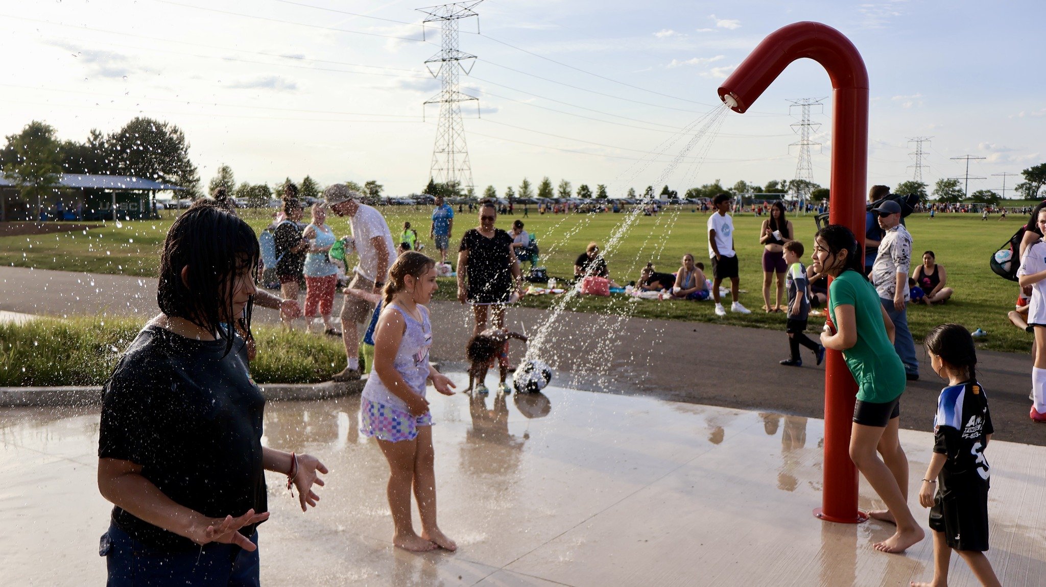Open soak station with water play beside the Mercyhealth Sportscore Two playground.