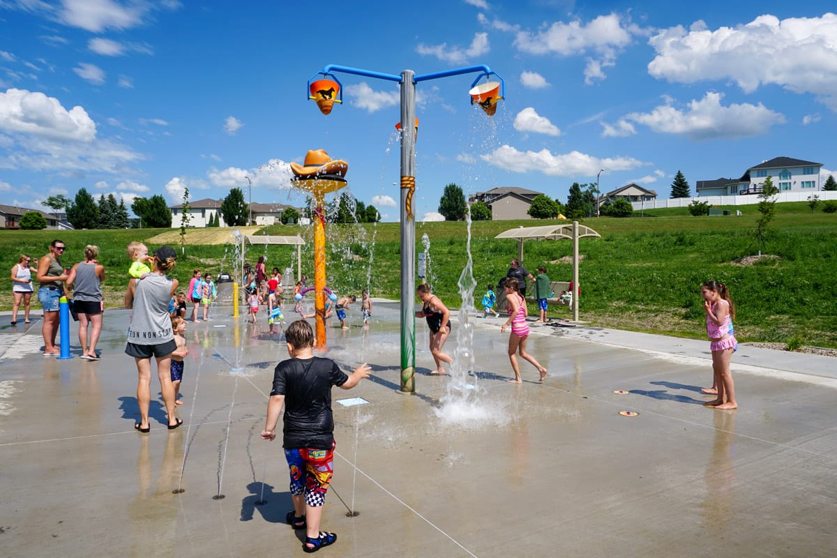 Kids playing in the water at New Generations Park Splash Pad.