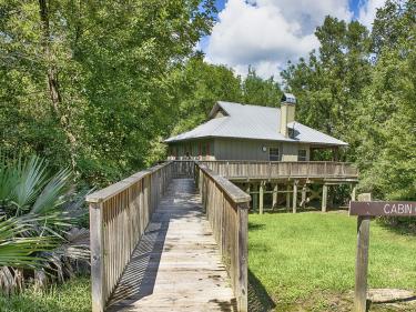 Palmetto Island State Park setting with cabins and grounds.