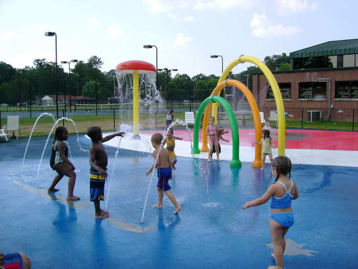 Children playing in the water features at Pepsi Splash Pad in Kinston.