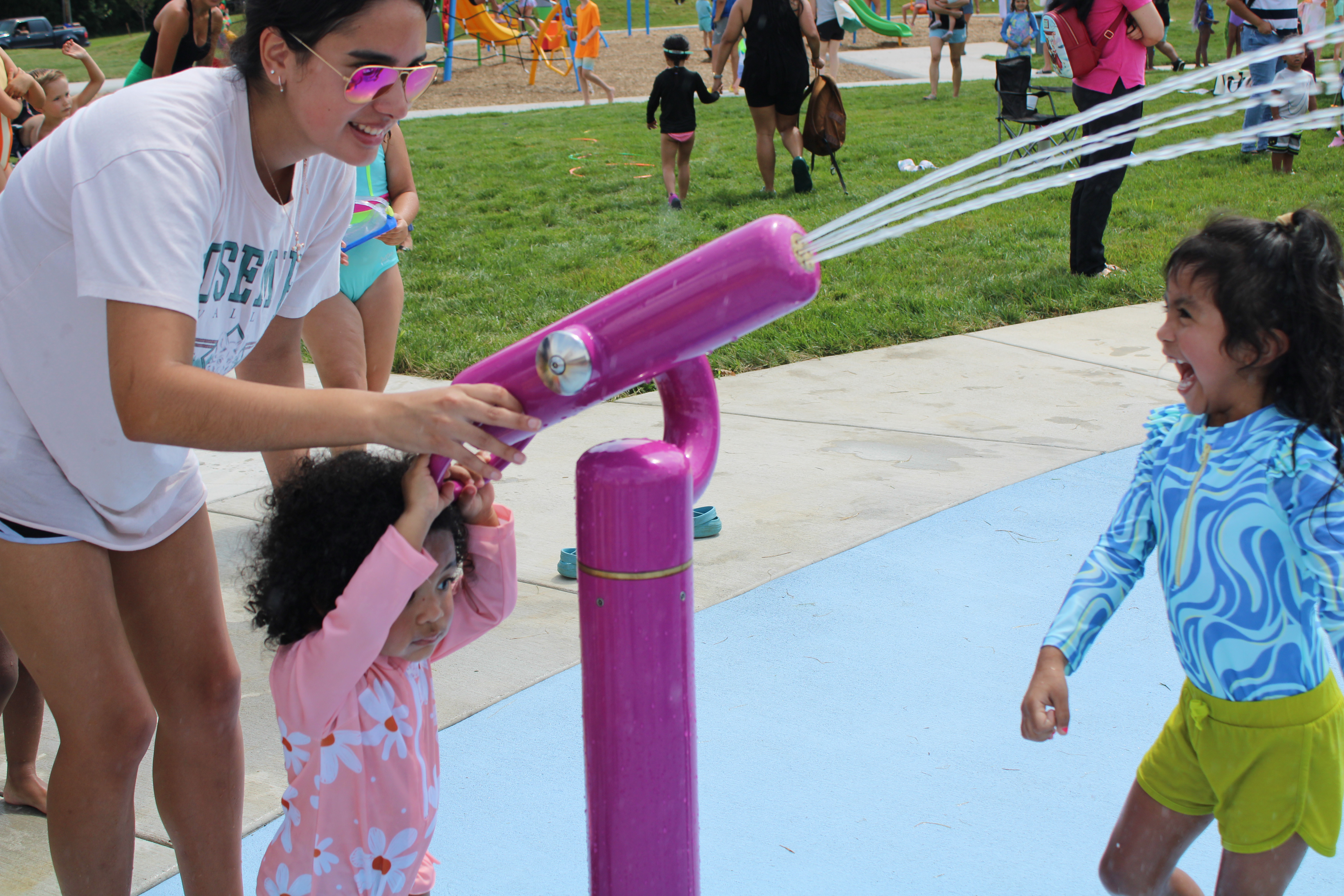 Children playing at Ralph Sampson Spraygrounds.