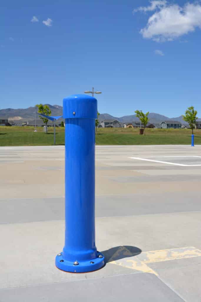 Blue activation pillar at Ron Wood Park Splash Pad.