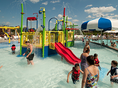 Splash Valley sprayground with kid-focused water play features.