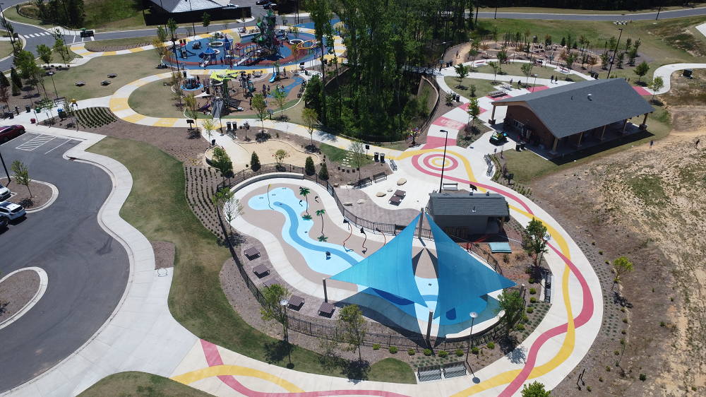 Splashlantis splash pad in Apex with water-play area and nearby park setting.