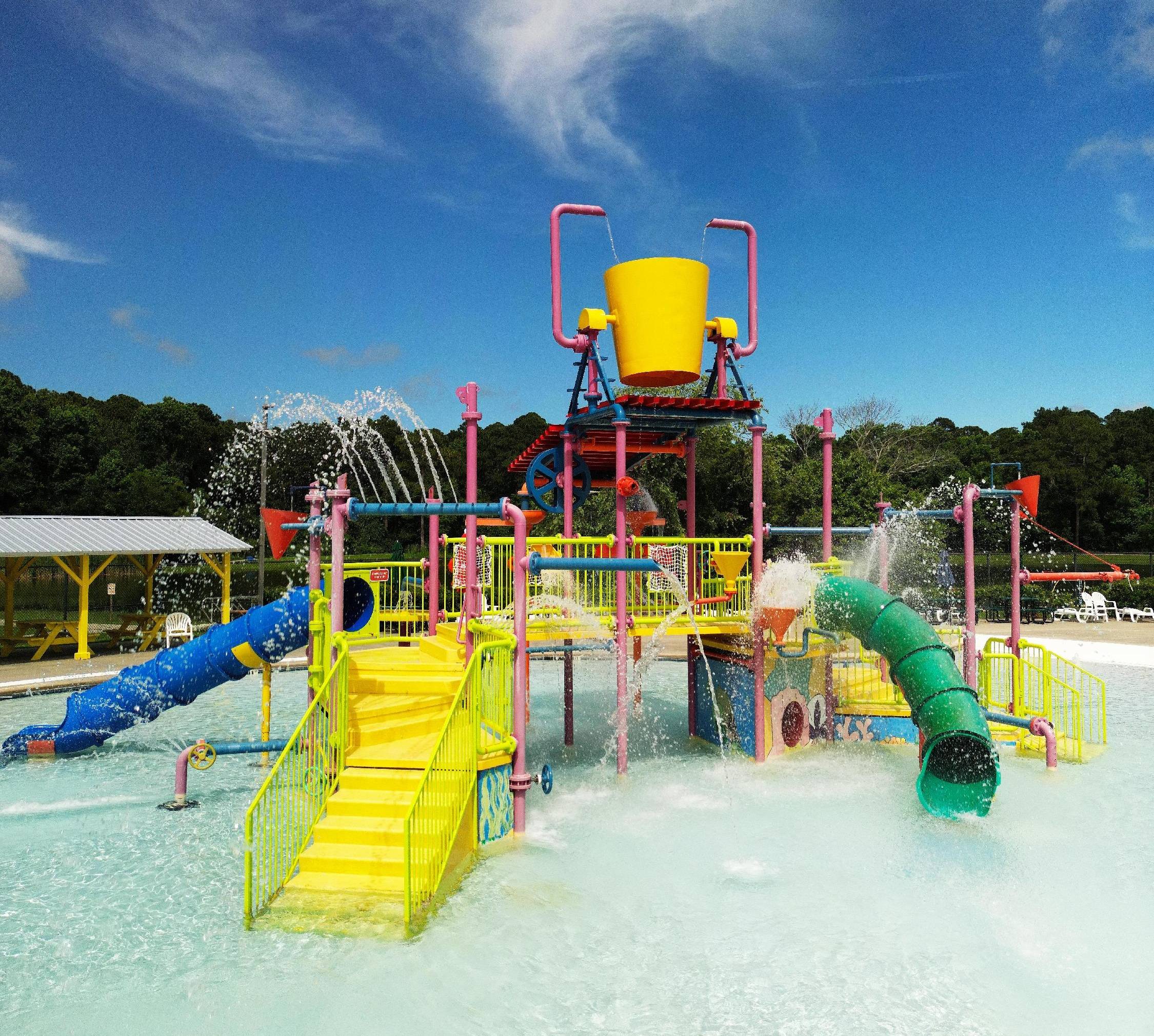 Children's water playground at St. Marys Aquatic Center with slides and spray features.