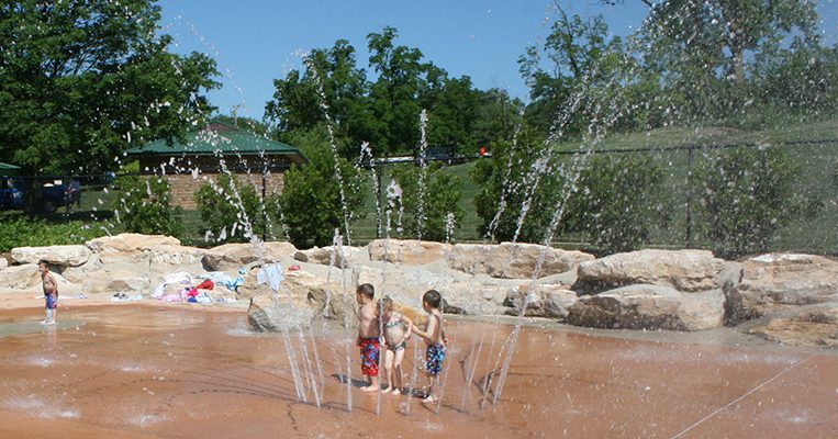 Children using the spraygrounds at Stephens Lake Park.