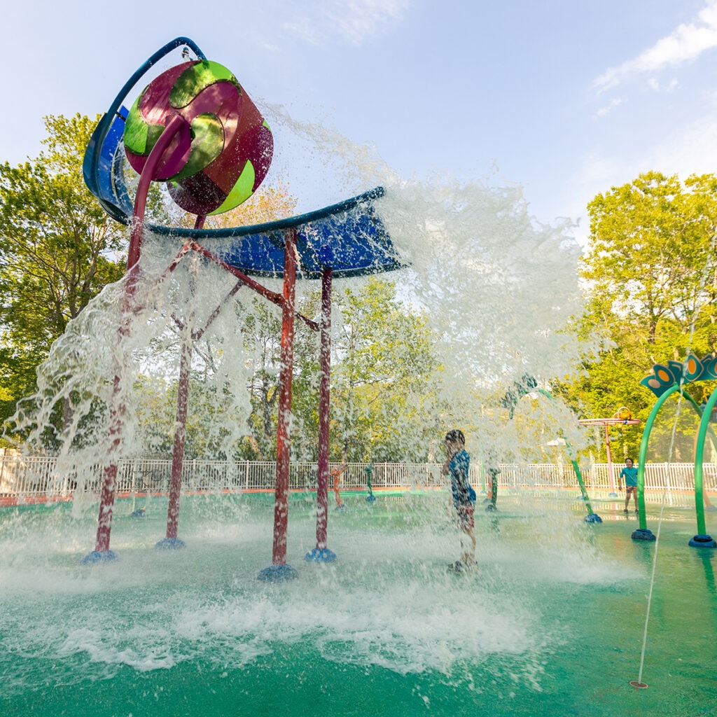 Dump bucket feature at the Dinosaur Place splash pad.