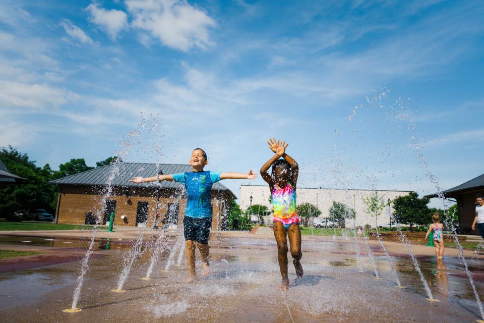 Ground-level spray fountain at Uptown Market Splash Pad in Greenwood.