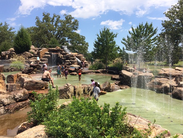 War Memorial Park splash pad in Little Rock with water features active.