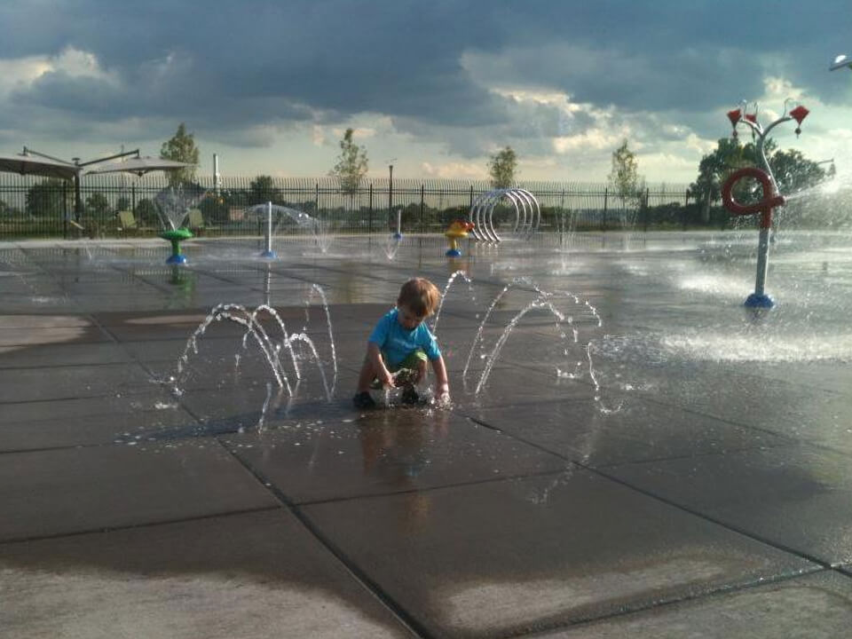 Children enjoying splash features at Wolf Lake Aquatic Play Center.